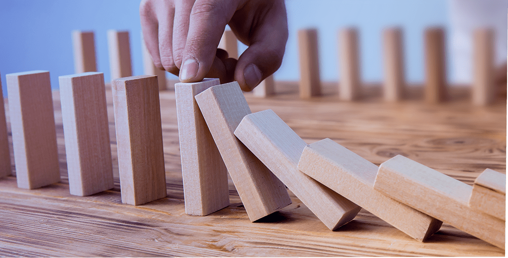 Hand guiding wooden domino tiles